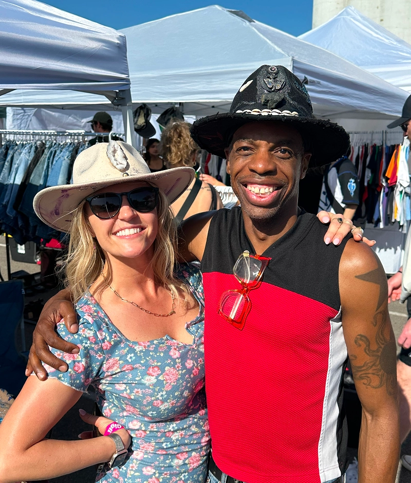 Happy pair posing under sunny skies